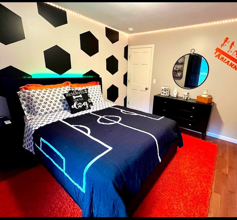 17. Graphic Soccer Pattern Bedroom in Black and Neon Accents - soccer bedroom ideas