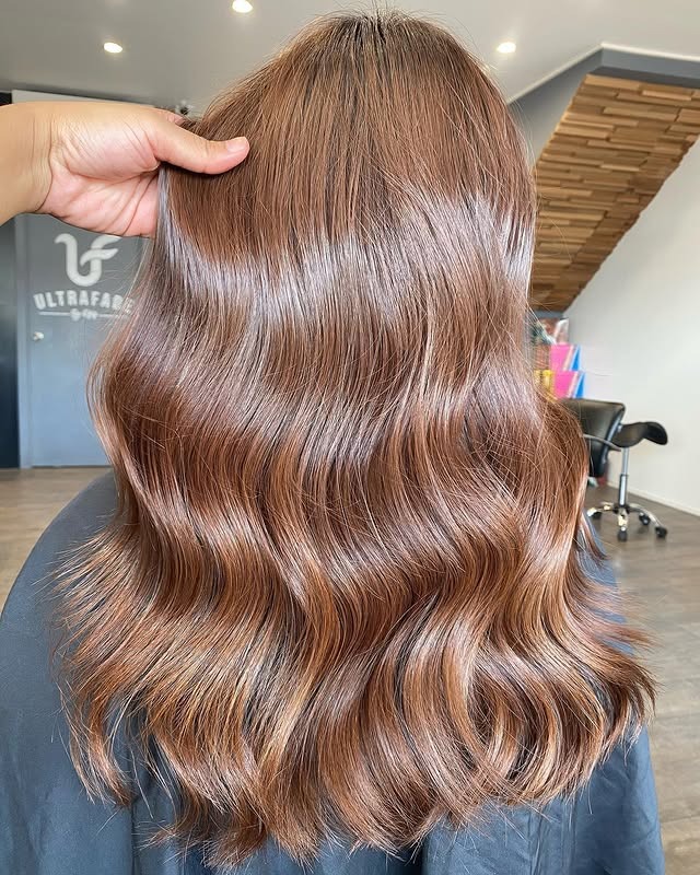 3. Glossy Mid-Length Waves in Classic Chestnut Brown - Warm Chestnut Hair Color