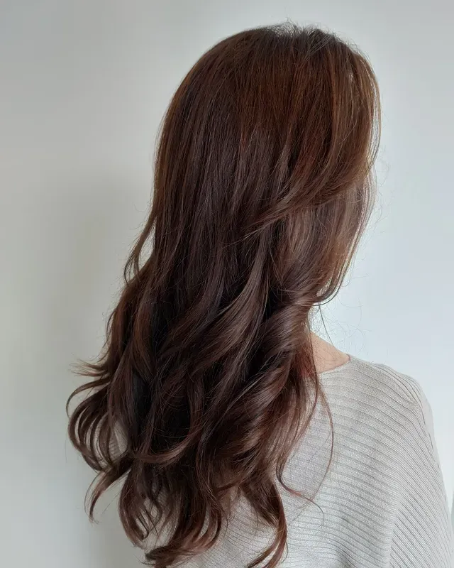 9. Long Layered Waves in Natural Chestnut Brunette - Warm Chestnut Hair Color