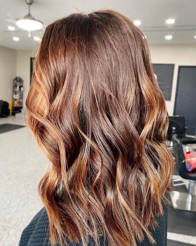 12. Shoulder-Length Waves with Caramel Chestnut Ribbons - Warm Chestnut Hair Color