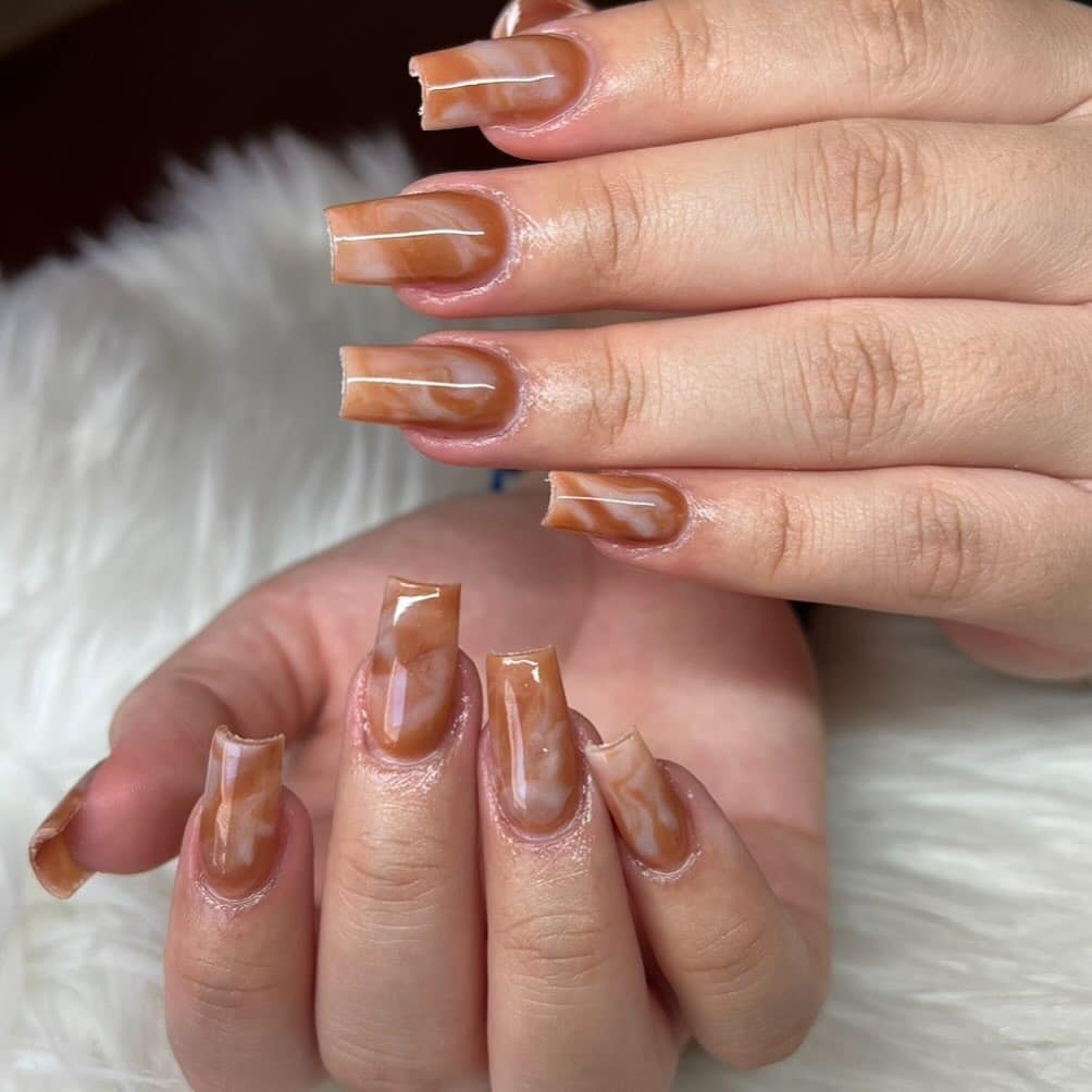 1. Caramel Marble Gloss Coffin Nails - small coffin nail ideas