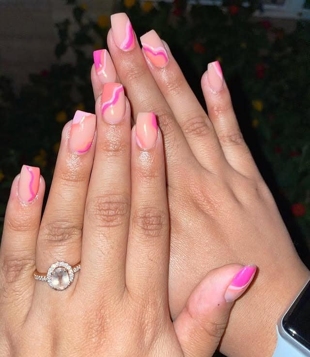 2. Nude Pink Swirl Coffin Nails - small coffin nail ideas