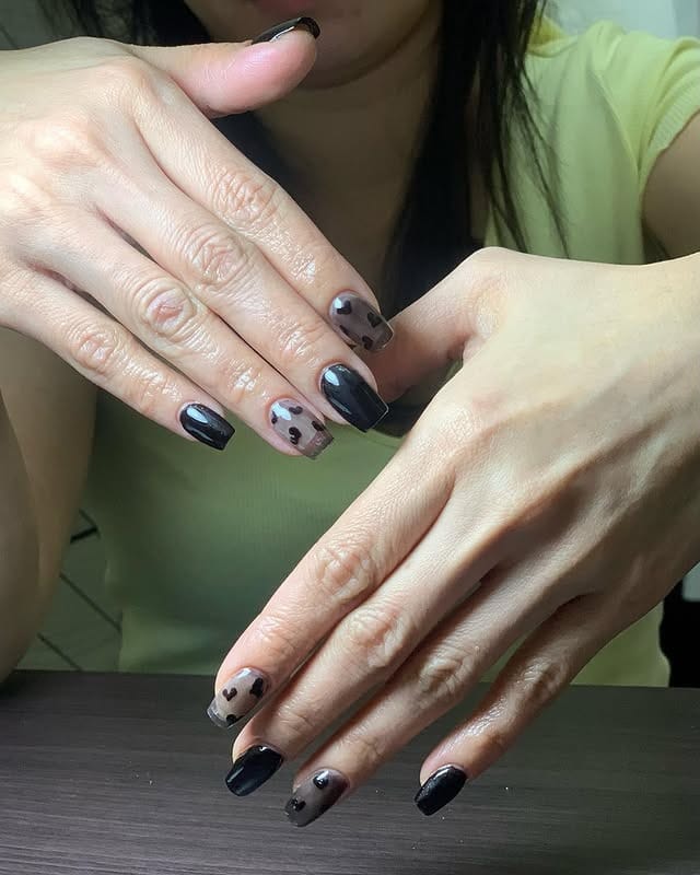 4. Black Sheer Heart Coffin Nails - small coffin nail ideas