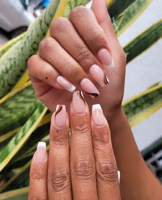 8. Classic French Tip Coffin Nails with Brown Lines - small coffin nail ideas