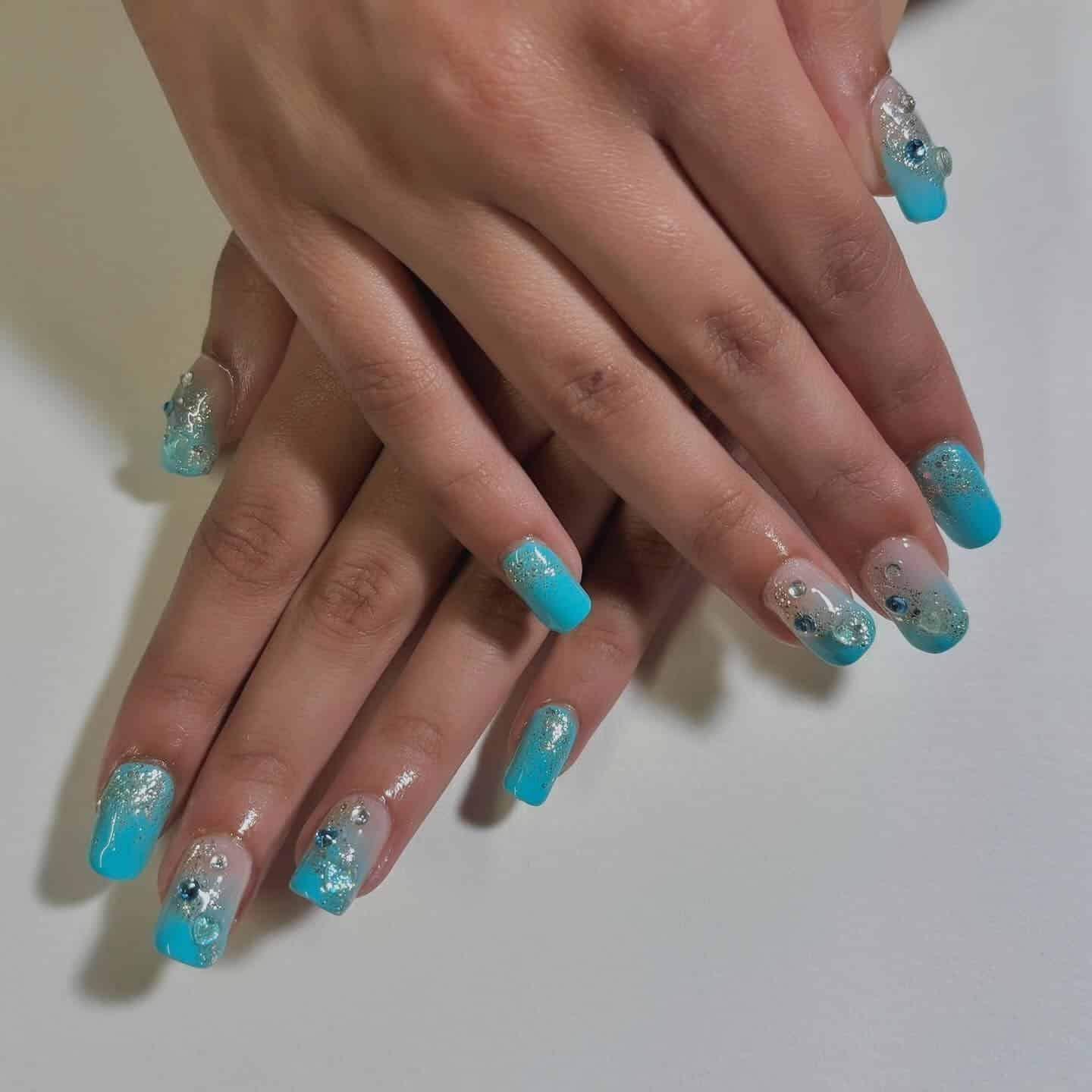 9. Aqua Glitter Ombre Coffin Nails - small coffin nail ideas