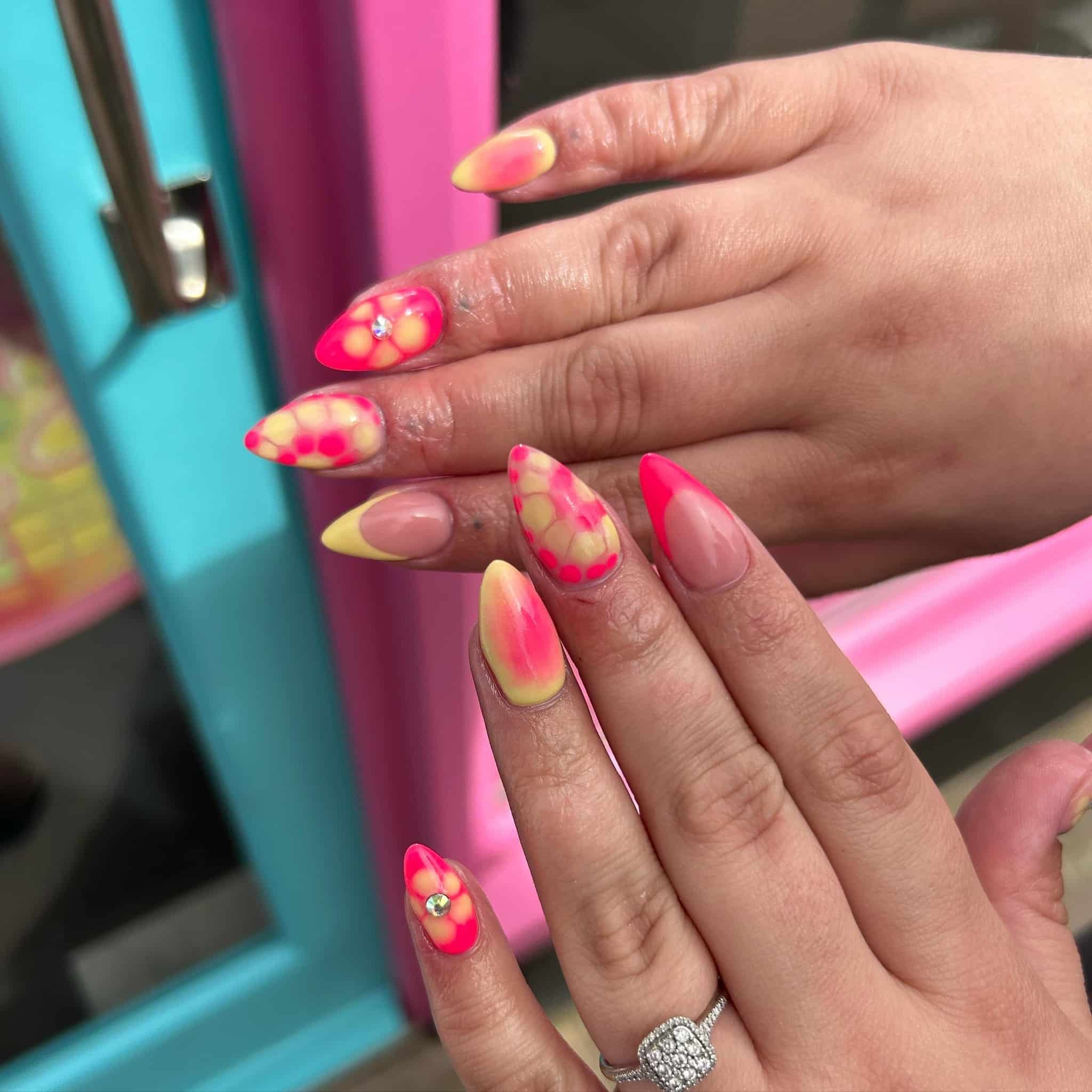 7. Neon Pink and Yellow Blooming Gel Almond Nails - yellow and pink nail ideas