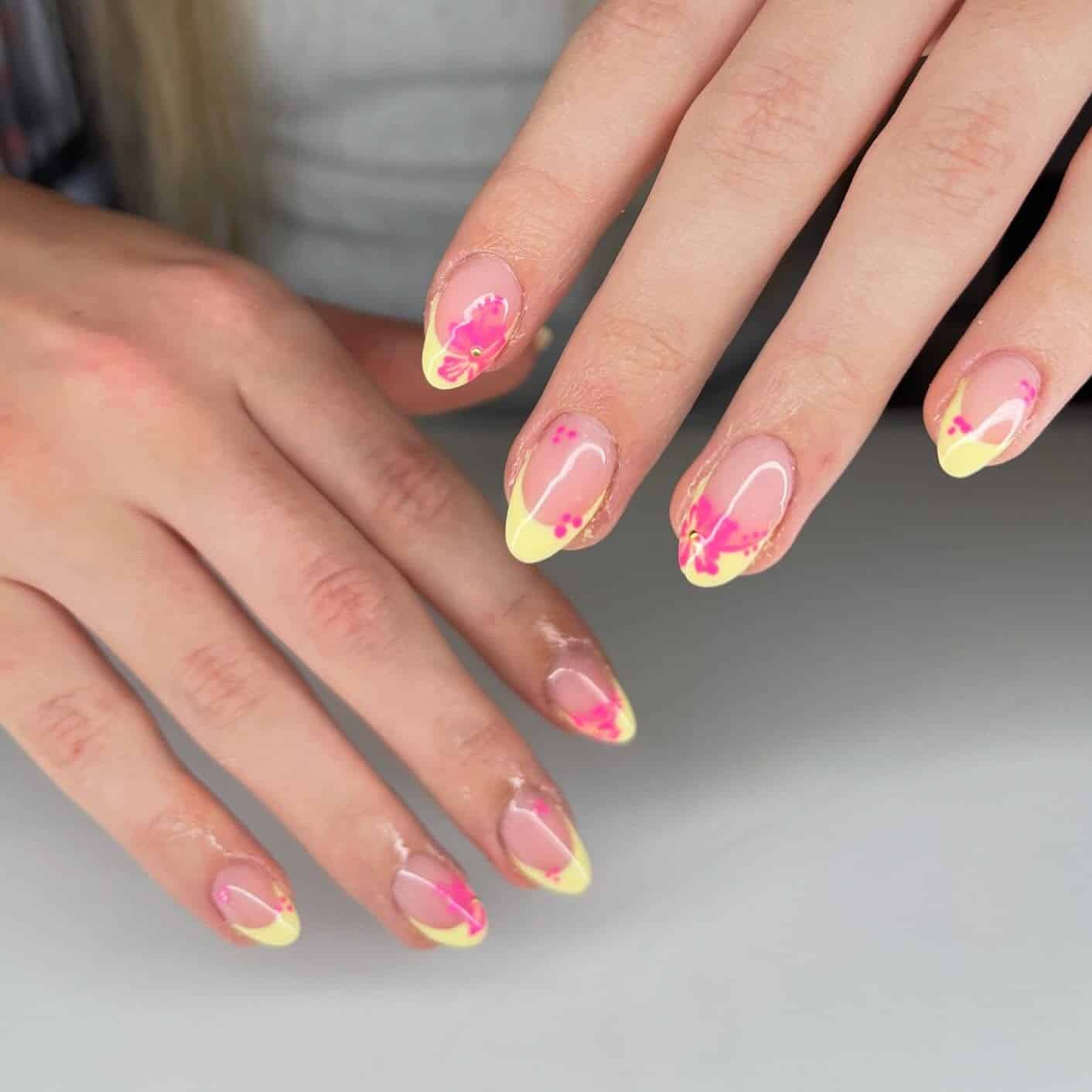11. Soft Yellow French Tip Almond Nails with Pink Floral Accents - yellow and pink nail ideas