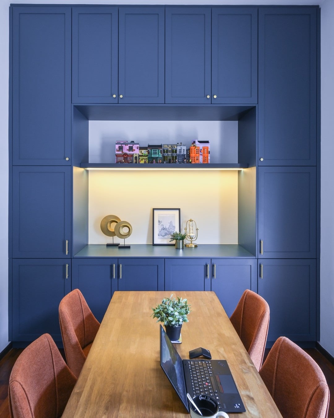 3. Classic Blue Built-In Accent Wall Storage - accent wall office ideas