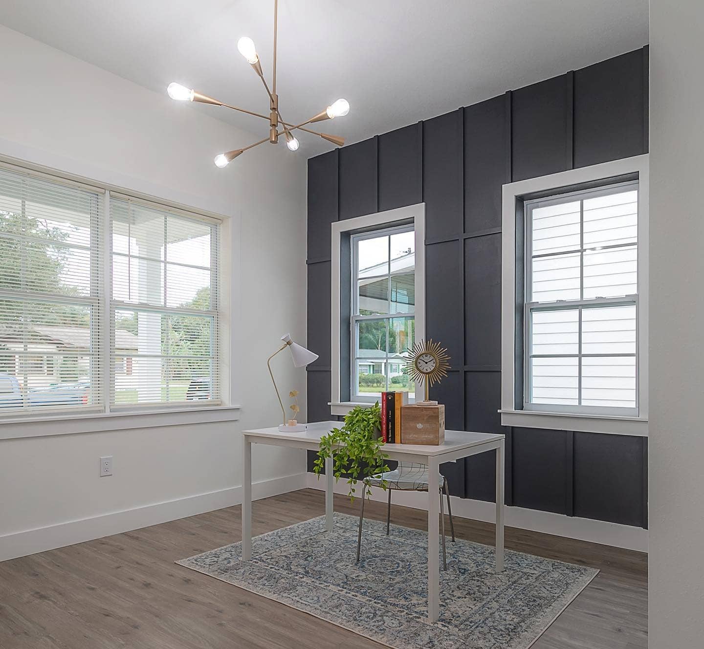 11. Charcoal Vertical Panel Accent Wall with Window Framing - accent wall office ideas