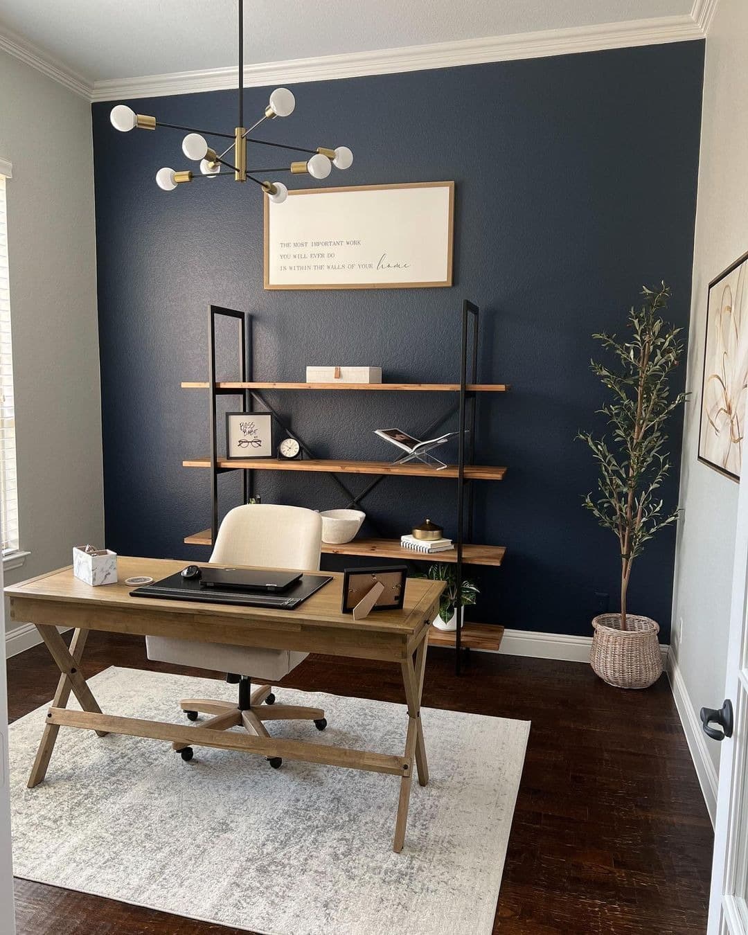 17. Navy Blue Solid Accent Wall with Open Shelving - accent wall office ideas