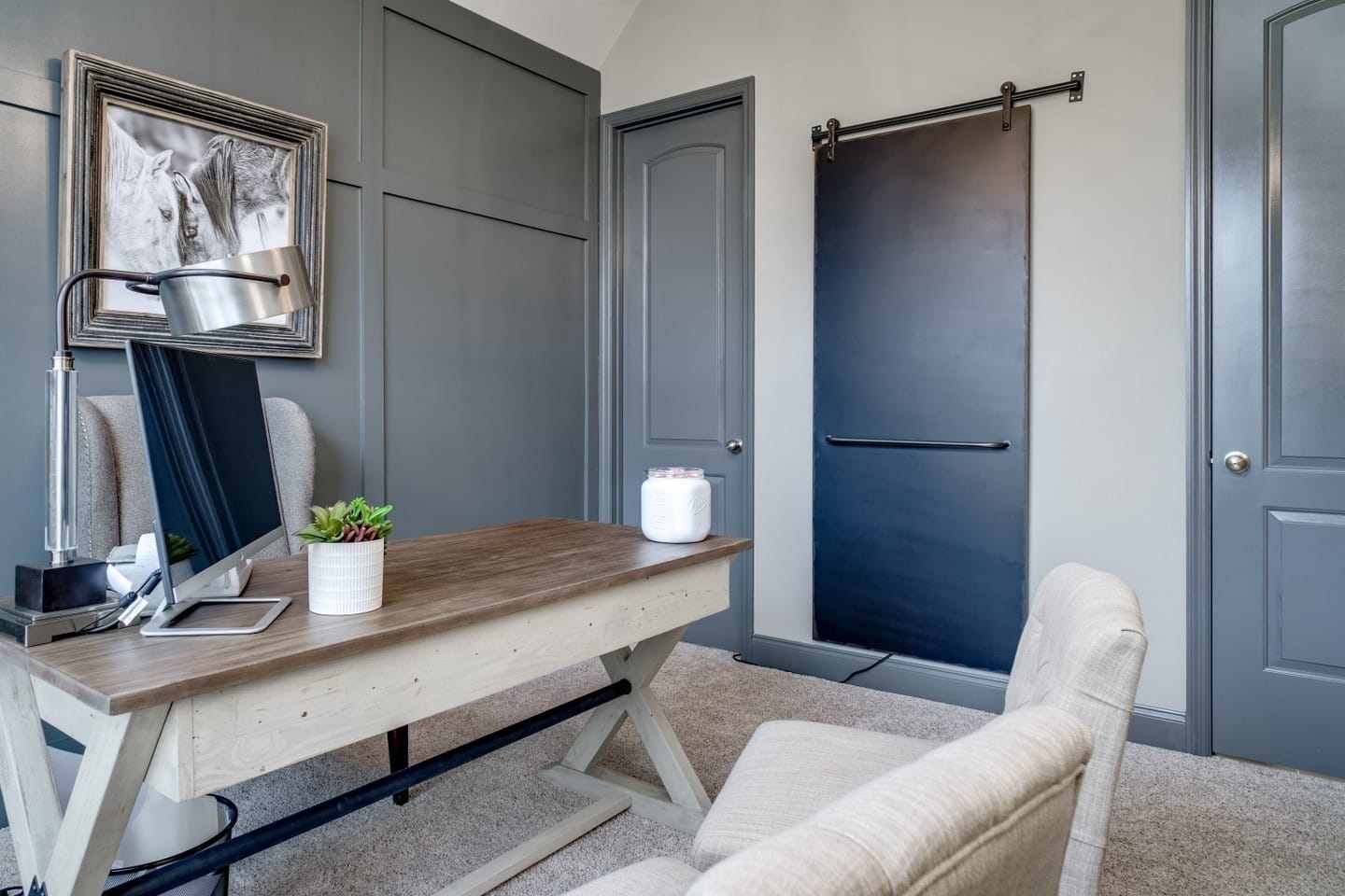 18. Muted Blue Paneled Accent Wall with Sliding Door Detail - accent wall office ideas