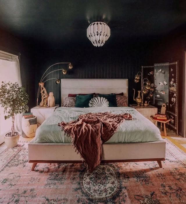 6. Moody Black Bedroom with Warm Pink and Earthy Layers - black and pink bedroom ideas