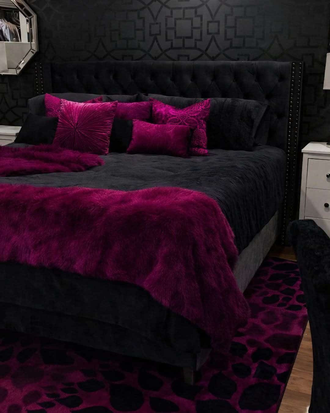 14. Dramatic Black Bedroom with Deep Pink Plush Layers - black and pink bedroom ideas