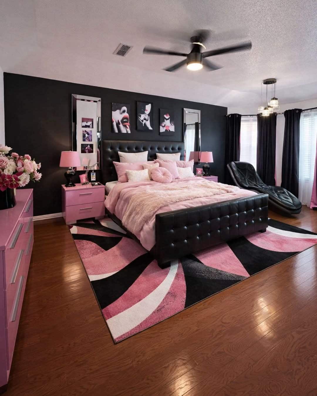 16. Contemporary Black Accent Wall with Soft Pink Furnishings - black and pink bedroom ideas