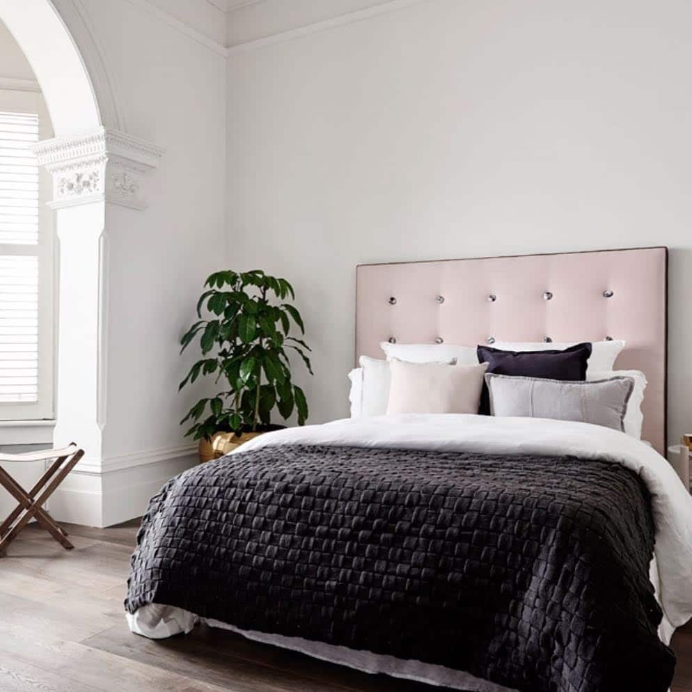 18. Minimalist Blush and Black Bedroom with Clean Lines - black and pink bedroom ideas