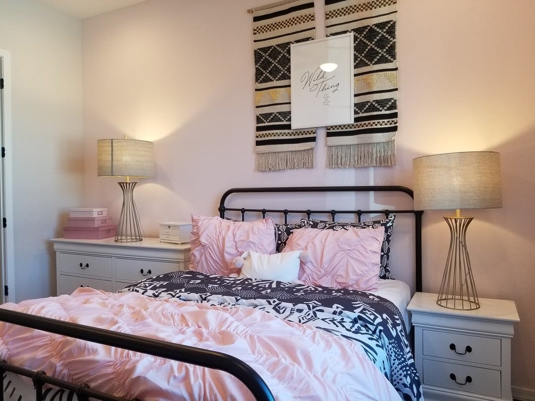 19. Cozy Pink and Black Bedroom with Mixed Textiles - black and pink bedroom ideas