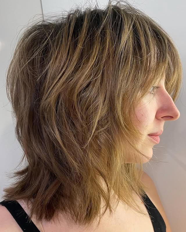 6. Layered Shag Cut with Wispy Fringe in Honey Blonde - Messy Fringe Haircut For Women