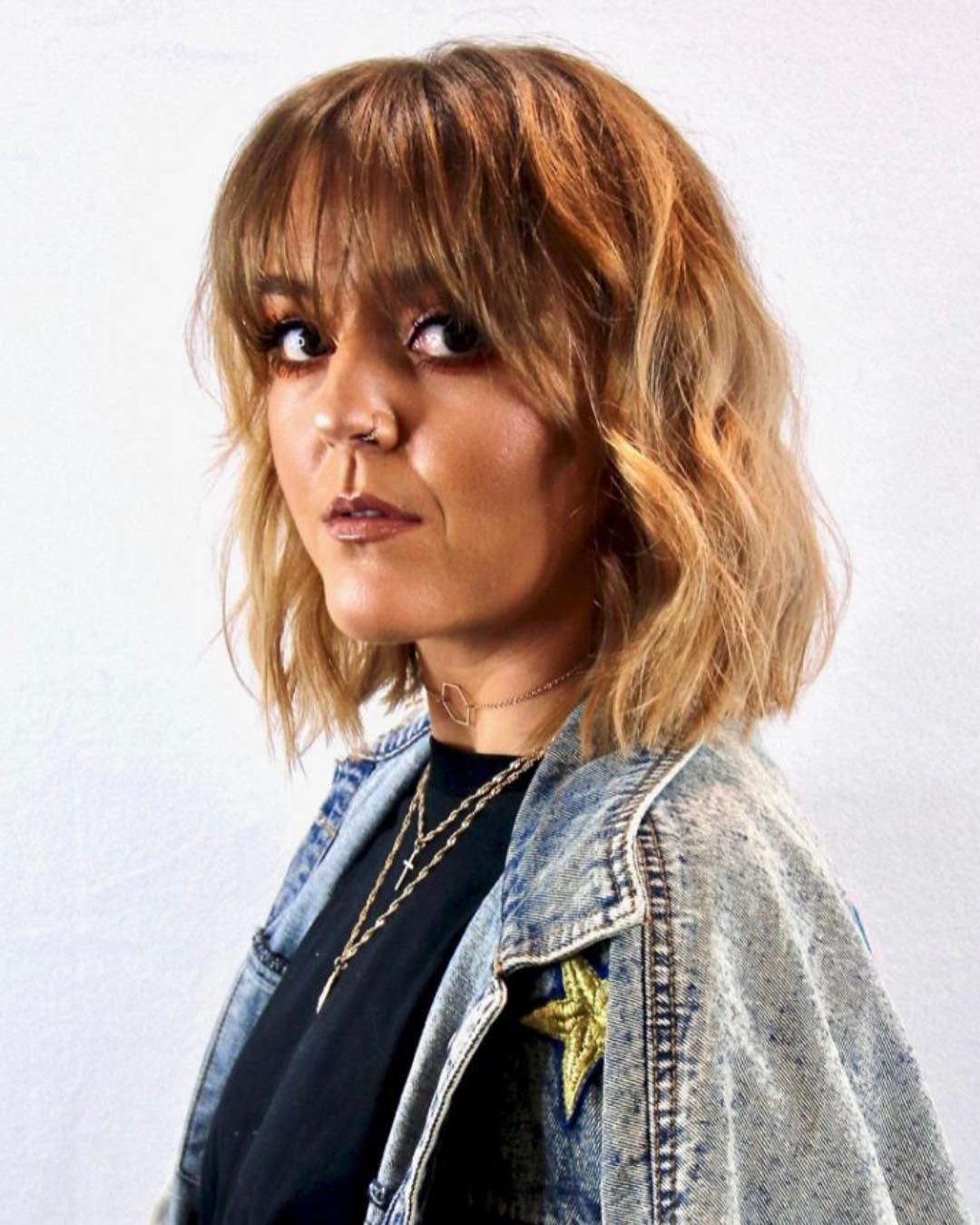 11. Textured Wavy Bob with Feathered Fringe in Golden Honey Blonde - Messy Fringe Haircut For Women