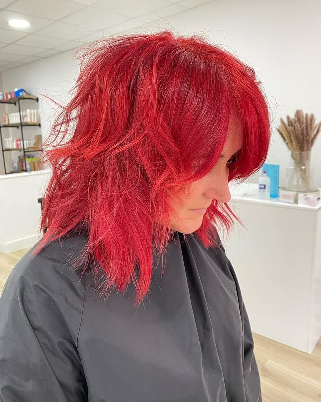 13. Shaggy Layered Cut with Full Fringe in Vivid Red - Messy Fringe Haircut For Women