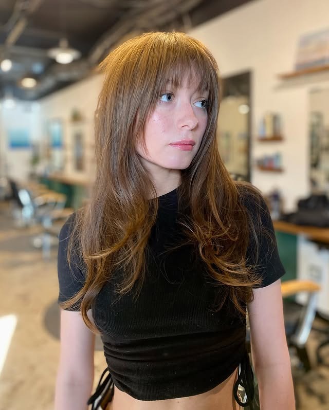 15. Long Layered Cut with Airy Fringe in Warm Light Brown - Messy Fringe Haircut For Women