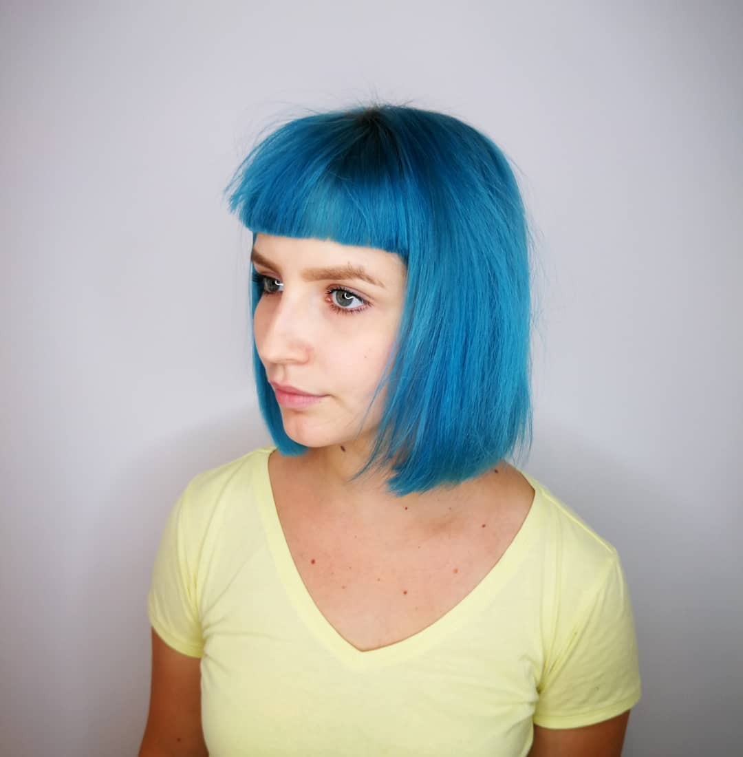 16. Sleek Precision Bob with Micro Fringe in Bright Teal Blue - Messy Fringe Haircut For Women