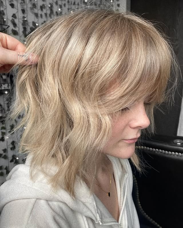 20. Wavy Layered Lob with Full Fringe in Creamy Beige Blonde - Messy Fringe Haircut For Women