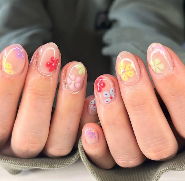 4. Short Sheer Bloom Nails with Bright Florals - spring nail ideas