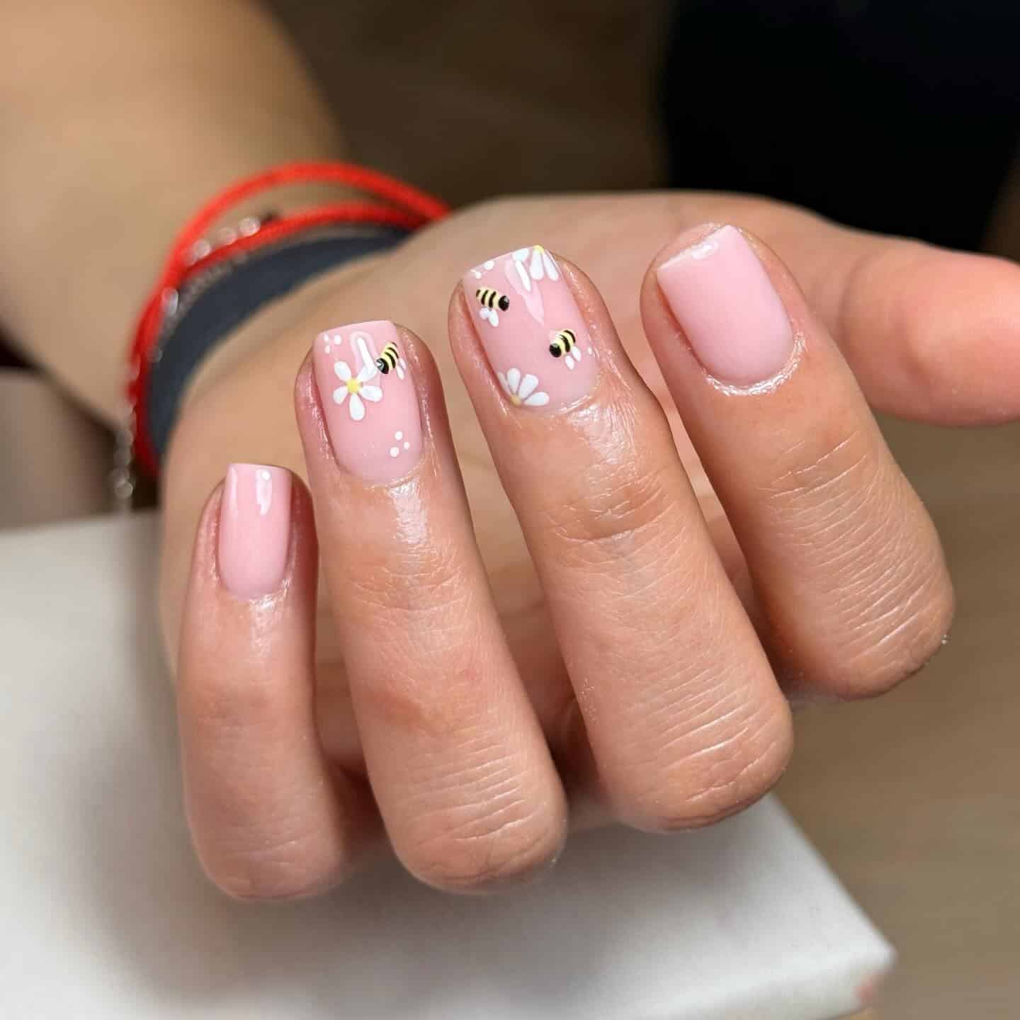 14. Soft Pink Daisy and Bee Short Nails - spring nail ideas
