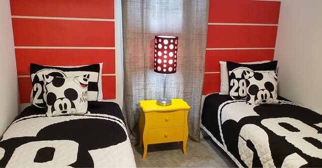 8. Classic Red Upholstered Bed with Black and White Accents - red, black and white bedroom ideas