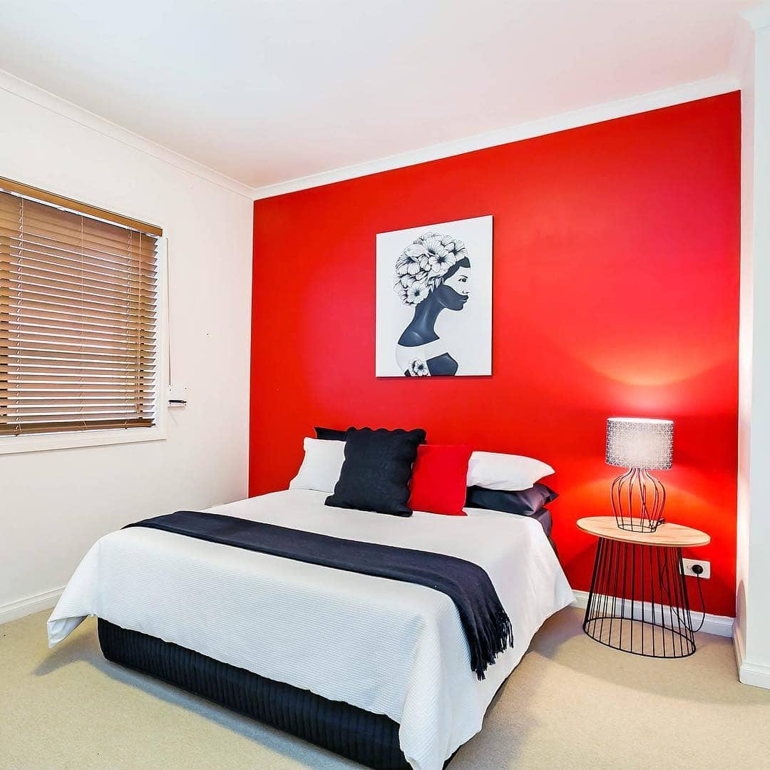 17. Minimal Red Accent Wall with Clean Black and White Styling - red, black and white bedroom ideas