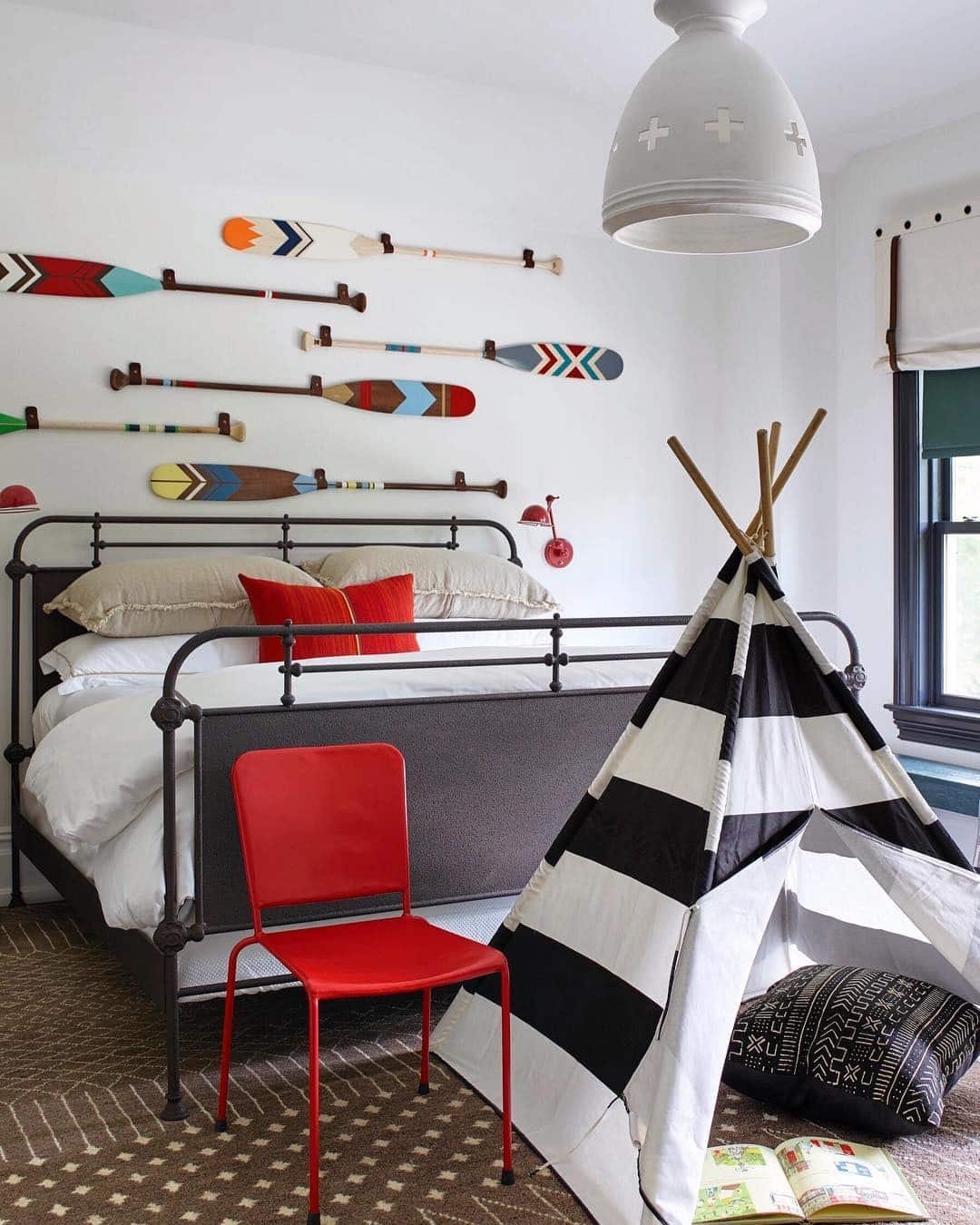19. Playful Black and White Bedroom with Red Accent Chair - red, black and white bedroom ideas