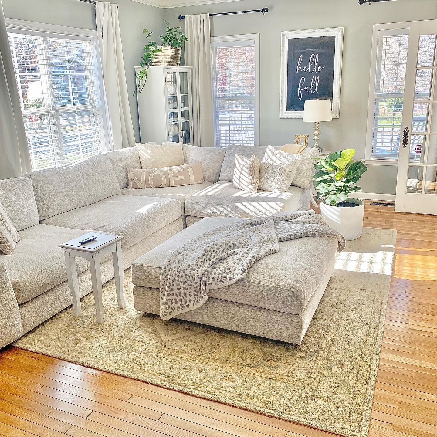 5. Relaxed Sectional Living with Warm Neutrals and Natural Light - french country living room ideas