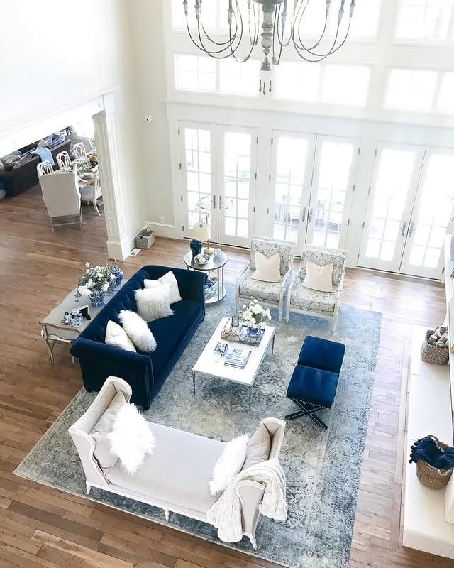 9. Airy Open Concept with Blue Accents and Pale Neutrals - french country living room ideas
