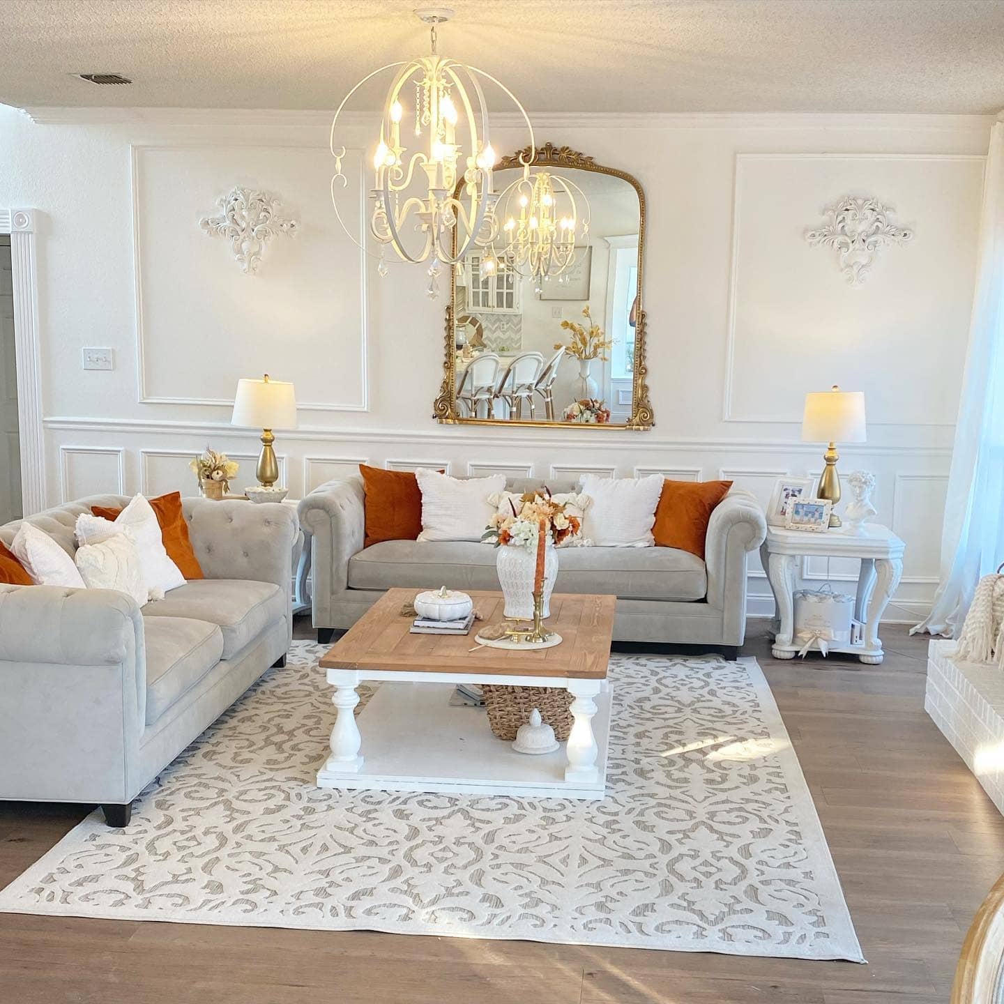 14. Elegant Panelled Living Room with Cream and Warm Gold Touches - french country living room ideas