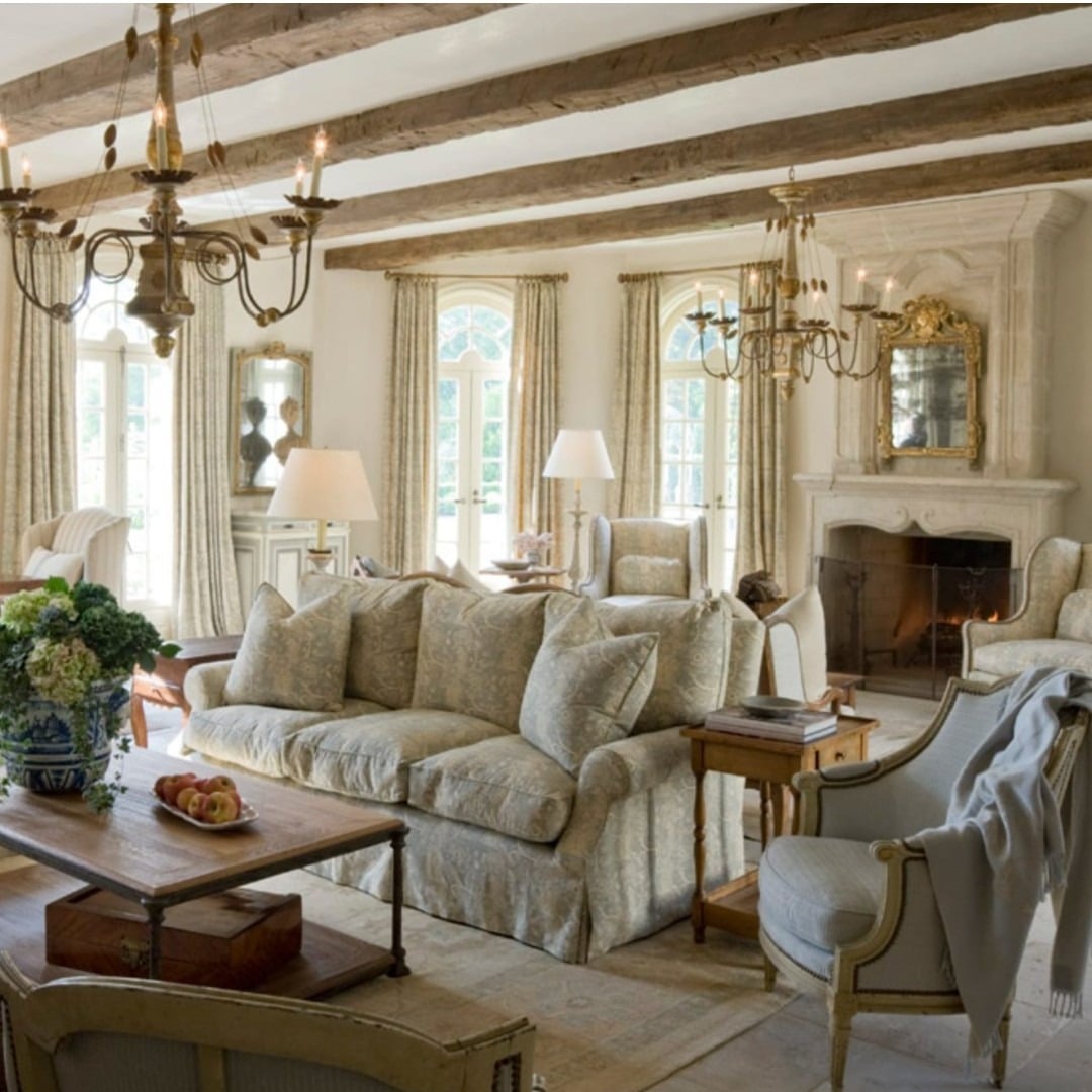 22. Classic French Country Elegance with Soft Neutrals and Aged Wood Beams - french country living room ideas