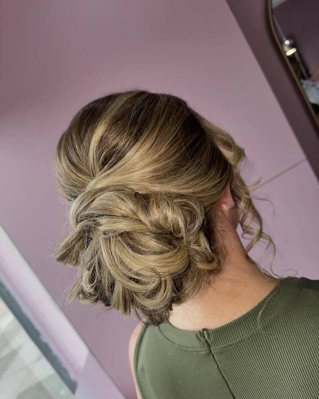 5. Dimensional Blonde Loose Knot Bun - Messy Bun Hairstyles