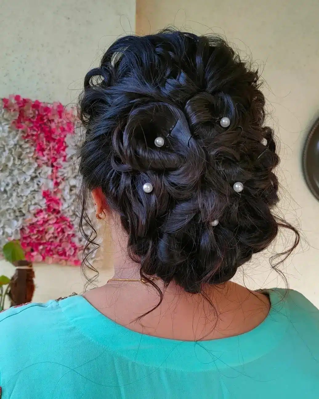 7. Textured Brunette Pearl-Studded Messy Bun - Messy Bun Hairstyles