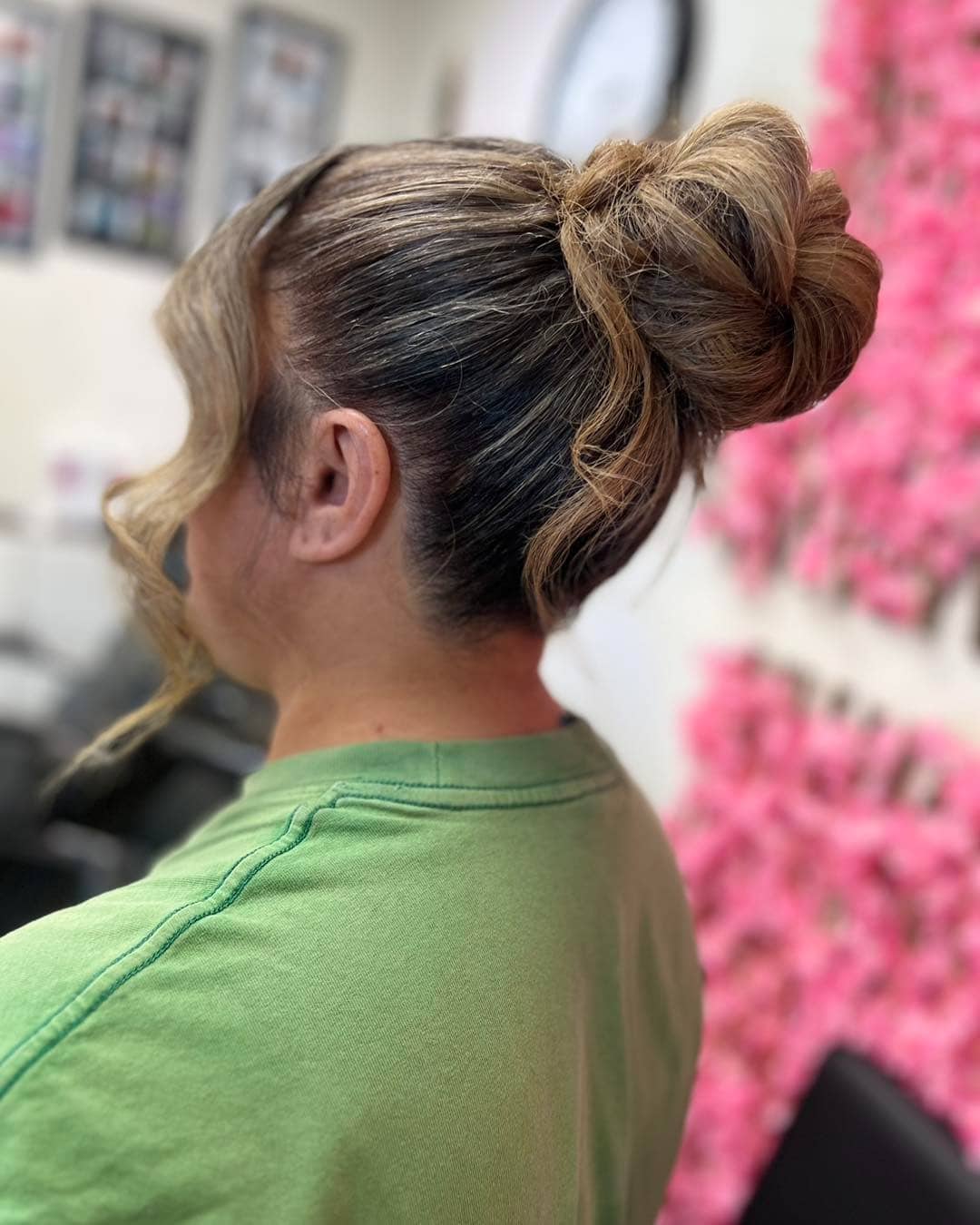 10. Honey Blonde Twisted High Bun with Face-Framing Curl - Messy Bun Hairstyles