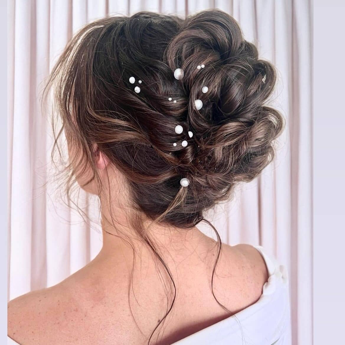 20. Soft Brown Textured Messy Bun with Pearl Accents - Messy Bun Hairstyles
