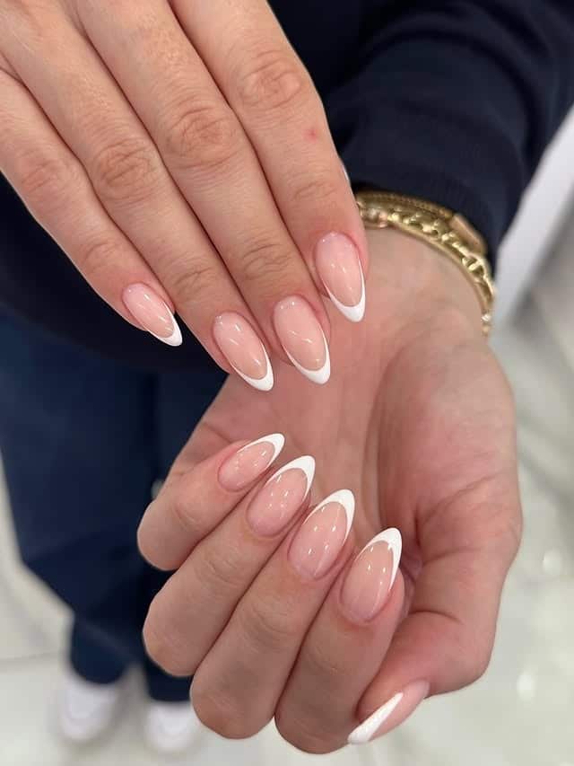 16. Almond French Tip Nails with Classic White Curve - french tip coffin nail ideas