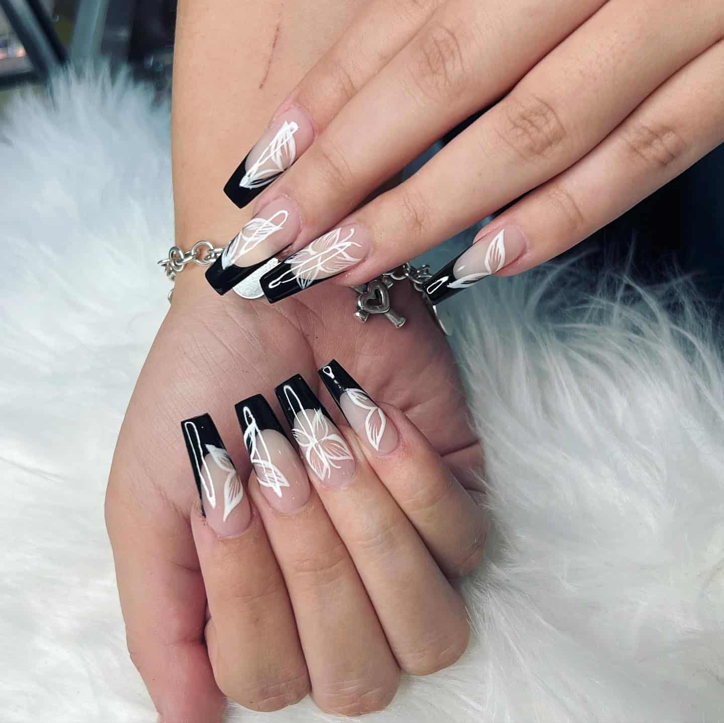 1. Black French Tip Floral Coffin Nails - first day of school nail ideas