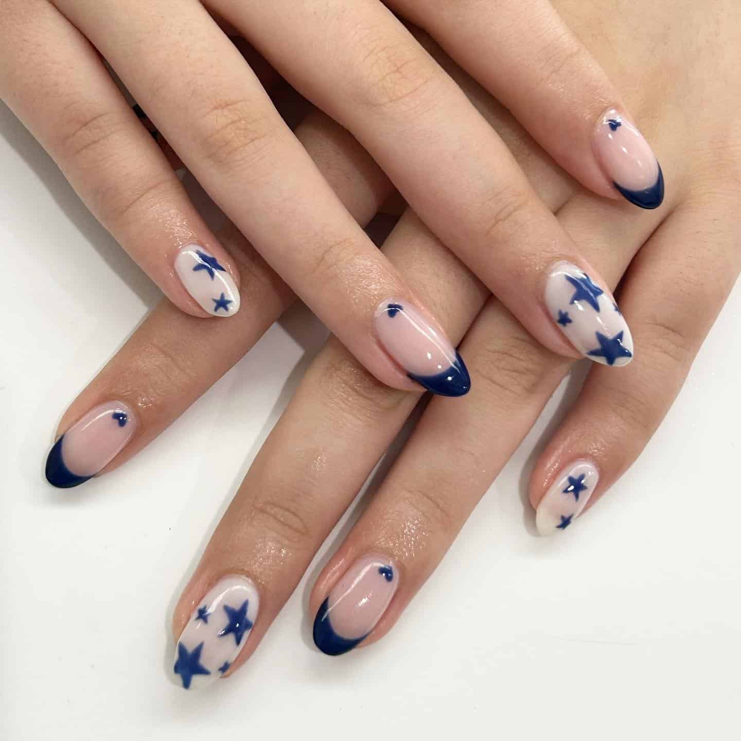 22. Navy Blue Star French Tip Almond Nails - first day of school nail ideas