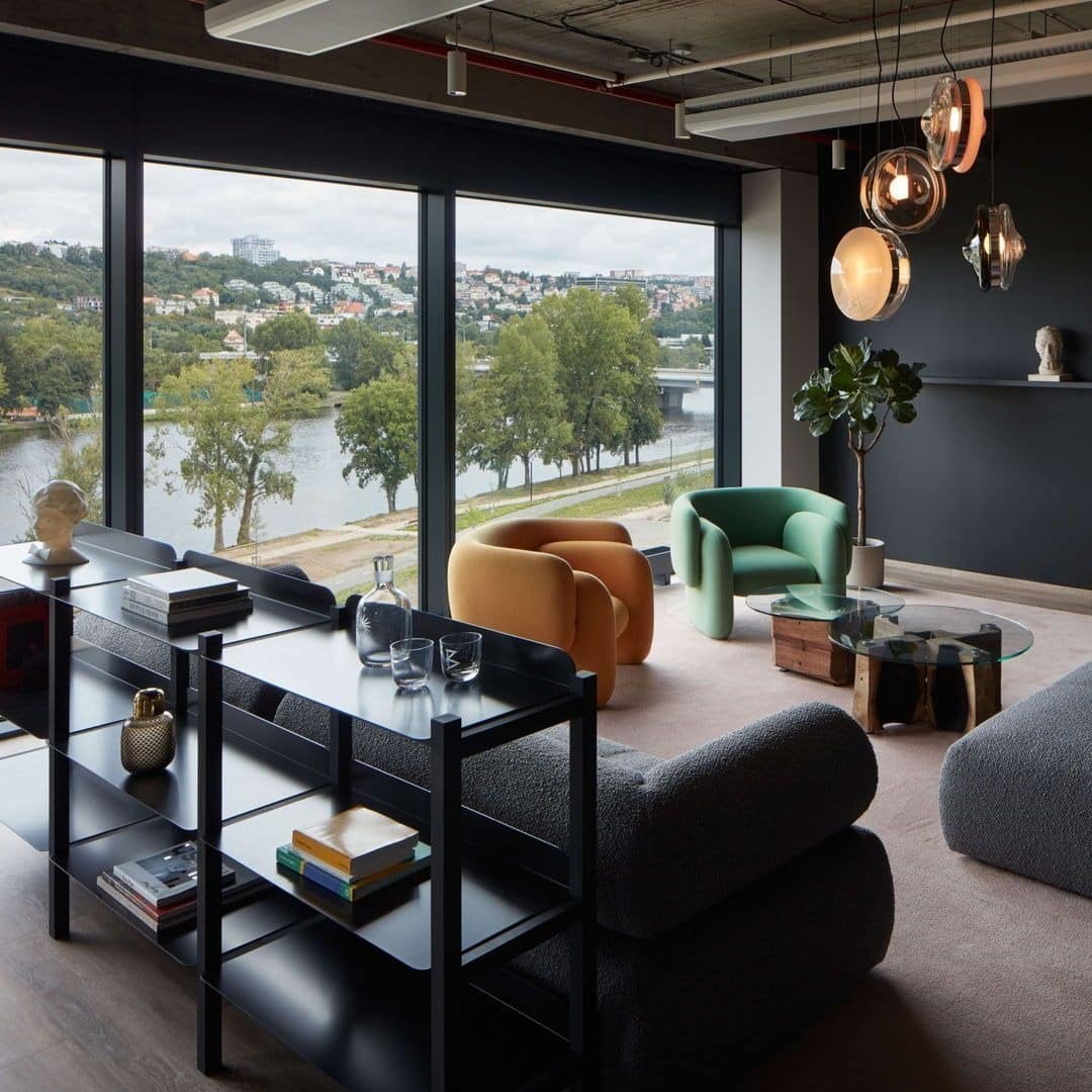 3. Dark Contemporary Lounge Office With River Views - creative office ideas