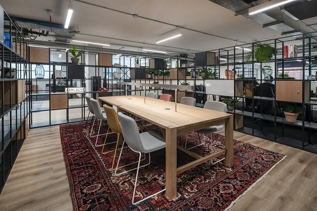 16. Industrial Open Office With Vintage Rug Accents - creative office ideas