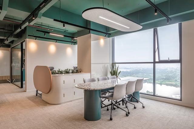 20. Modern Teal and Cream Meeting Space - creative office ideas