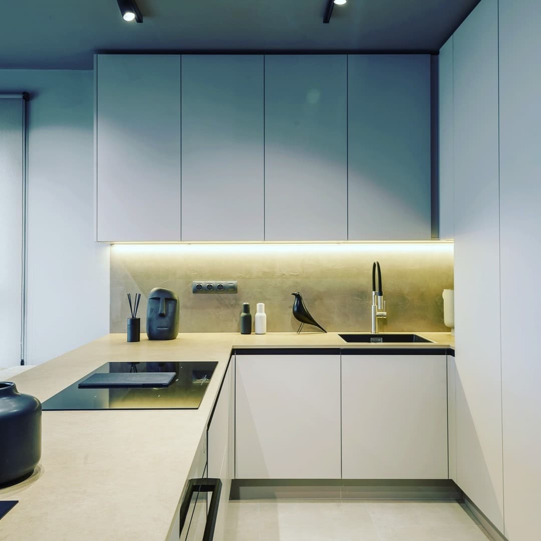 5. Matte White Corner Kitchen With Hidden Storage - corner kitchen ideas