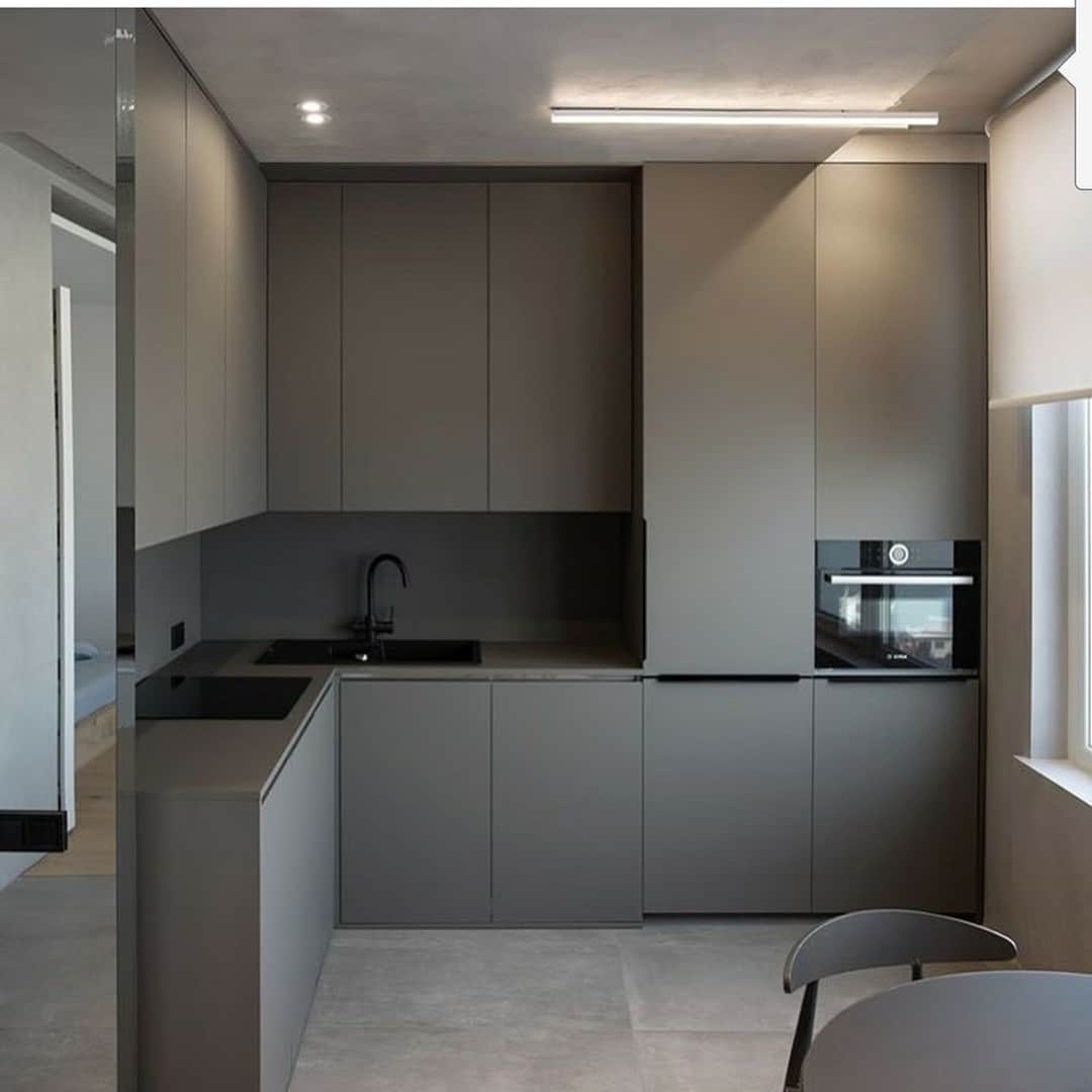 9. Charcoal Minimalist Corner Kitchen With Seamless Cabinets - corner kitchen ideas
