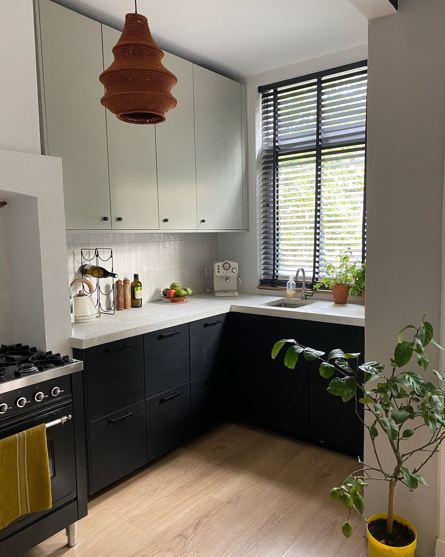 10. Two-Tone Corner Kitchen With Black Lower Cabinets - corner kitchen ideas