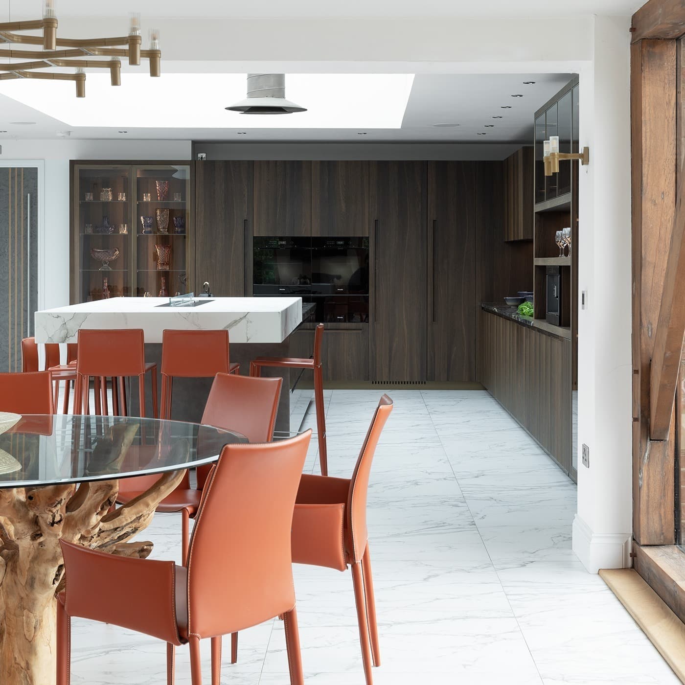 14. Dark Walnut Corner Kitchen With Marble Island - corner kitchen ideas