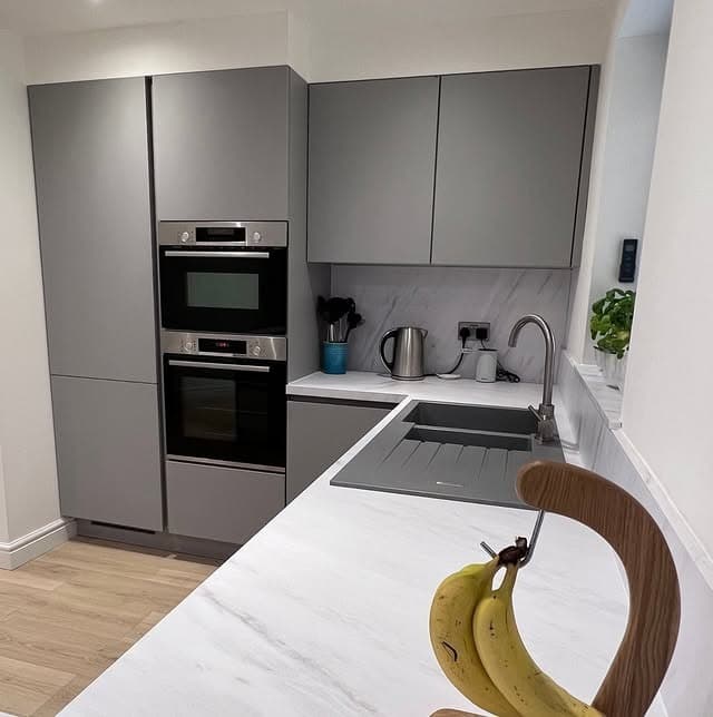 17. Soft Gray Corner Kitchen With Marble Counters - corner kitchen ideas